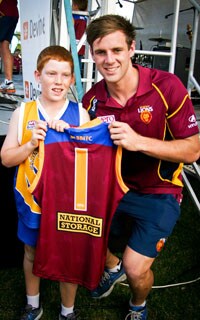 Sam Docherty is presented with his Number 1 guernsey at the 2013 Family Fun Day